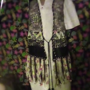 Dor Dor Bohemian Textured Embellished Sweater Vest With Long Tassels.